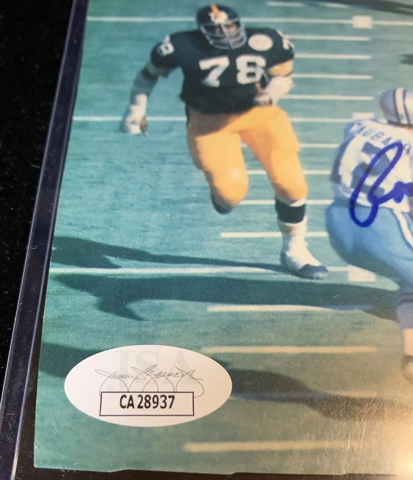 Framed football photograph of Roger Staubach from Super Bowl displayed for Dallas Cowboys fans
