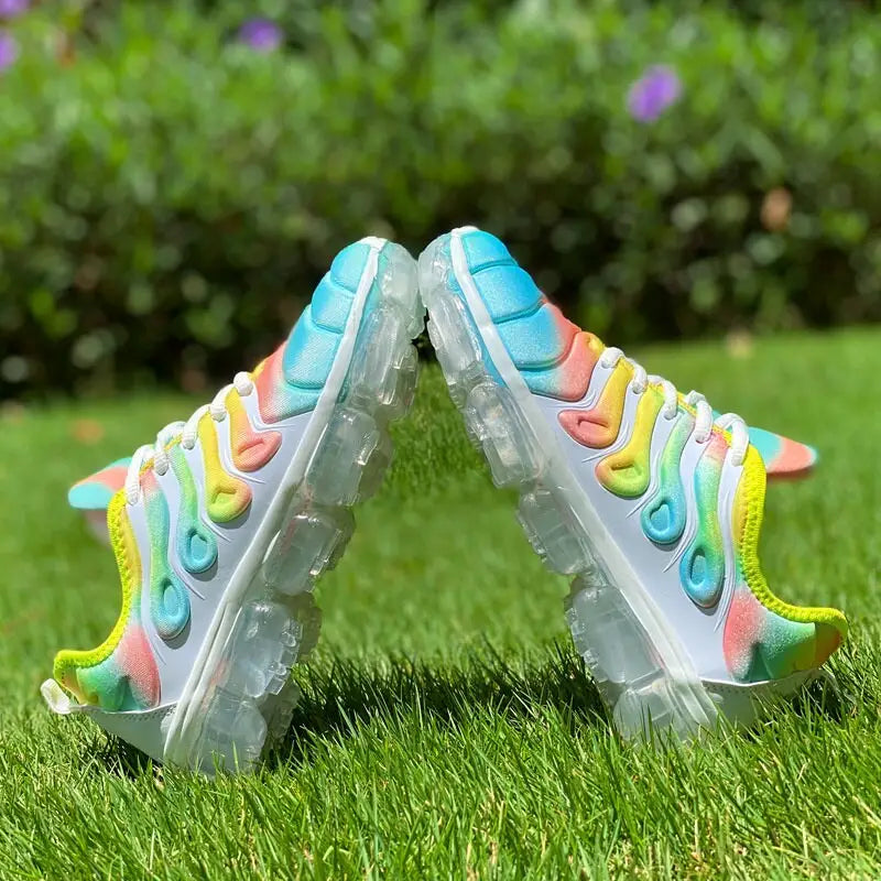 White athletic sports shoes with translucent soles and rainbow gradient for running training fitness