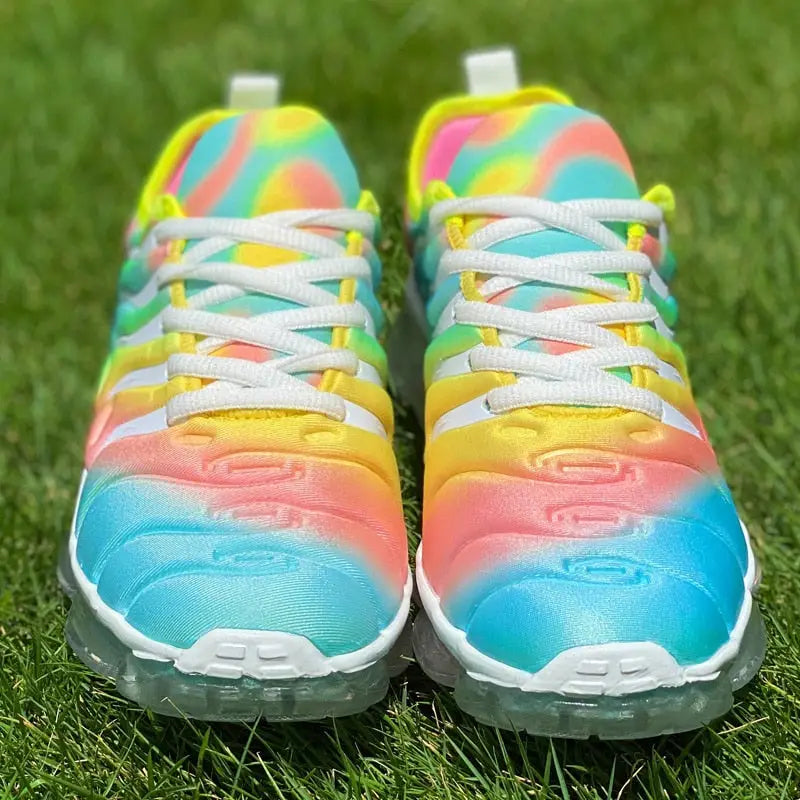 Colorful women sports shoes with tie-dye design, white laces, and translucent soles