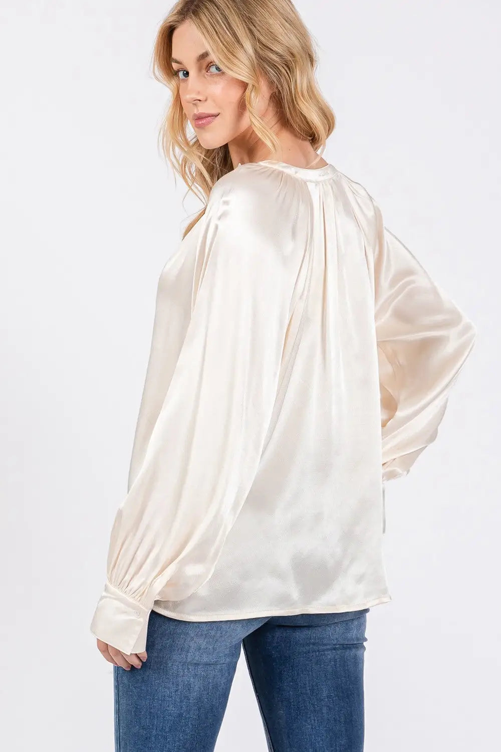 Women’s long-sleeve cream satin blouse with blue jeans from SAGE + FIG Notched Long Sleeve Blouse