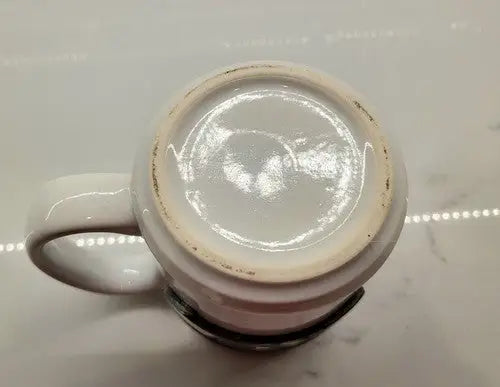 White ceramic coffee mug bottom featuring Seattle Seahawks NFL logo ceramic coffee cup