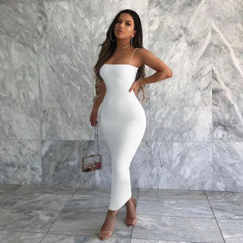 Sexy spaghetti strap bodycon maxi dress worn by a woman in a white evening gown