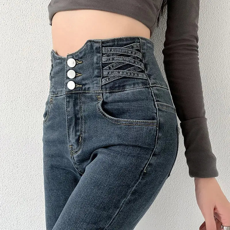 Vintage high waist skinny pencil jeans with three front buttons and decorative lacing