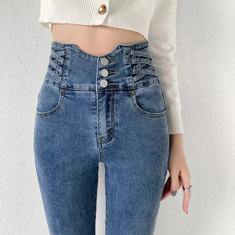 Skinny pencil jeans with vintage high waist, corset-style lacing, and three buttons
