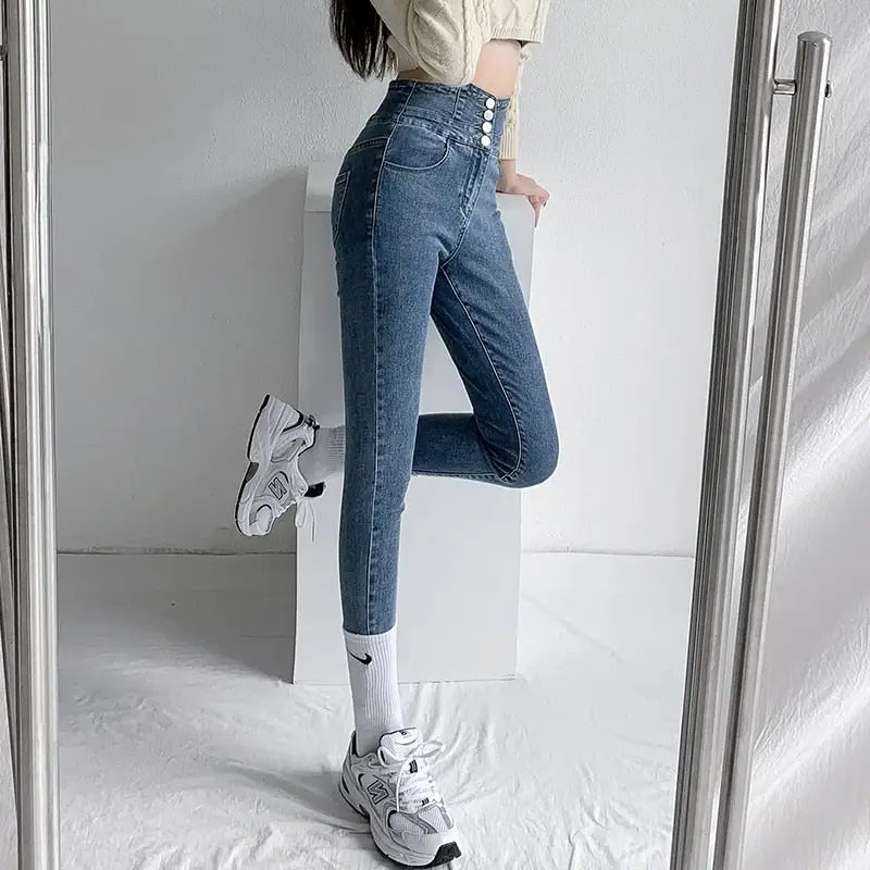 Light blue vintage high waist skinny pencil jeans with four front buttons for women