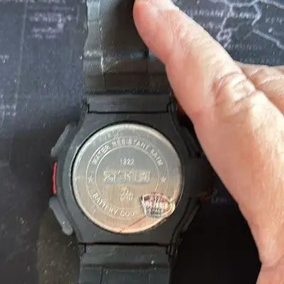 Black digital sport watch with water resistant feature and metal back for outdoor use