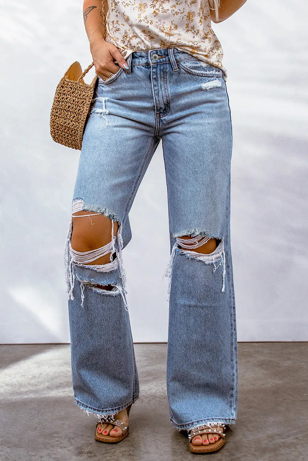 Sky Blue Destroyed Wide Leg Jeans with Ripped Knees and Frayed Hems for a relaxed style