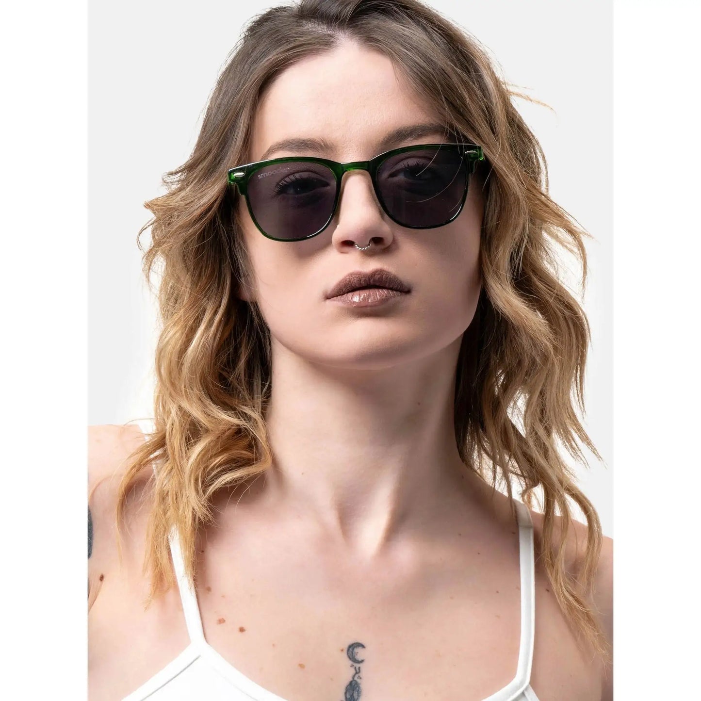 Woman with wavy blonde hair wearing Smooder Sunglasses Superior Green Sonora_X023