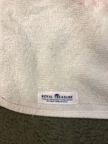 White terrycloth towel with tag featuring Star Wars characters C3PO and R2-D2