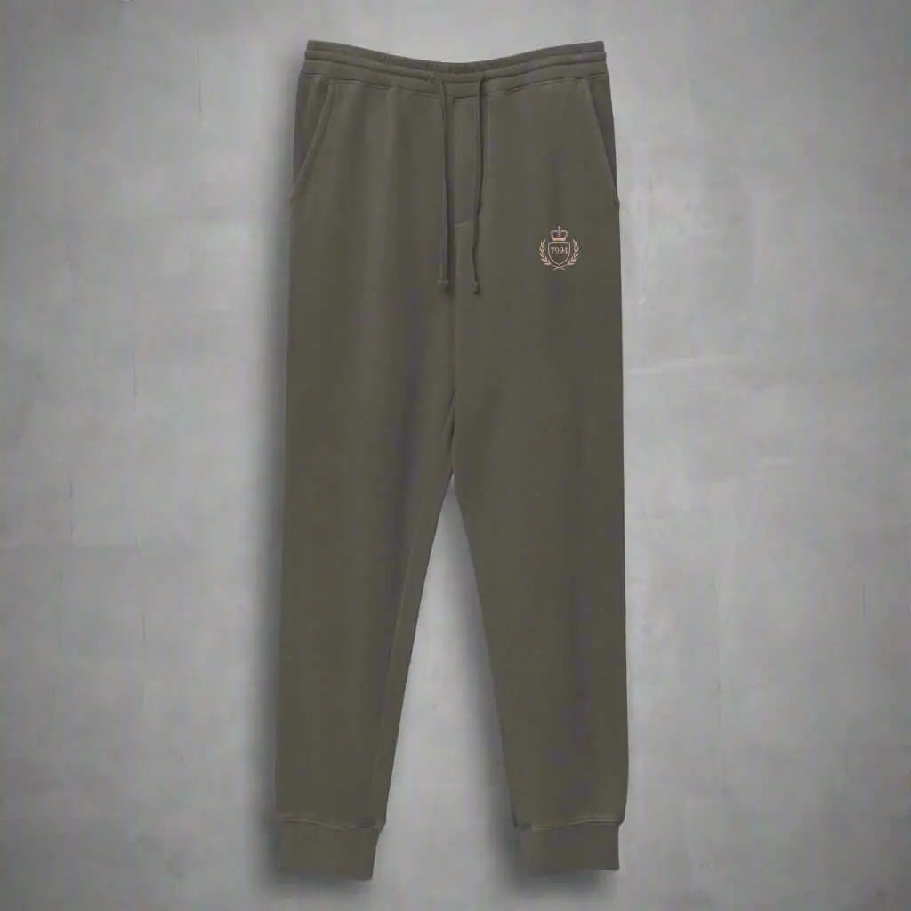 Olive green crested luxe joggers with elastic waistband, drawstring, and ribbed cuffs