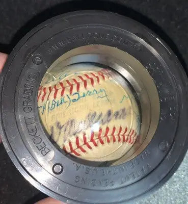 Autographed baseball in Beckett holder featuring Ted Williams signed HOF official American League baseball