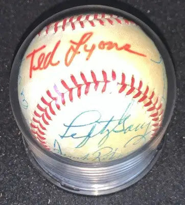Signed HOF baseball featuring Ted Williams in protective case, official American League collectible