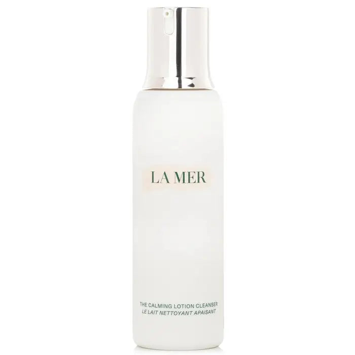 White frosted glass bottle of La Mer calming lotion cleanser with silver pump dispenser