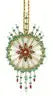 Ornate cracker box Christmas ornament with starburst design and dangling beads