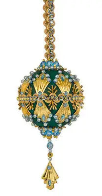 Elaborately decorated green and gold Christmas ornament with jewels from Cracker Box Ornament Kit