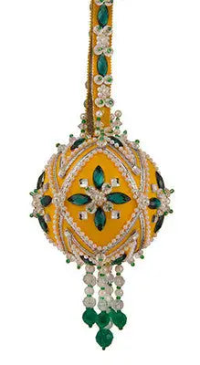 Decorative yellow and green Christmas ornament with beads and gemstones from Cracker Box Ornament Kit