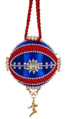 Blue and red decorative ornament with gold figurine charm from The Cracker Box ornament kits