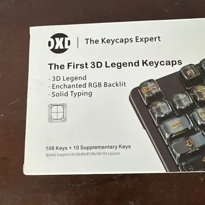 Box of The Keycaps Experts Oshed Amber 3D Legend Keycaps Set with RGB backlit solid typing keycaps