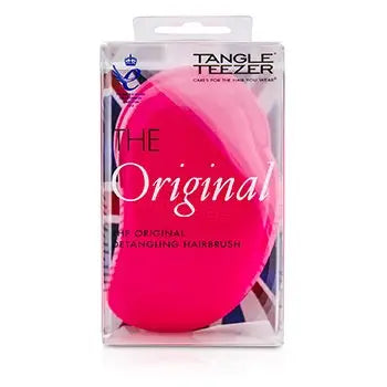 Hot pink detangling hair brush in clear plastic packaging for wet and dry hair