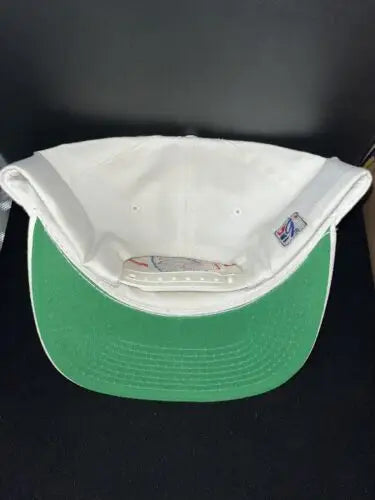 White snapback cap with green brim featuring Thurman Thomas and Buffalo Bills branding