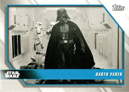 Darth Vader in black armor striding down a corridor for Star Wars Day promo card