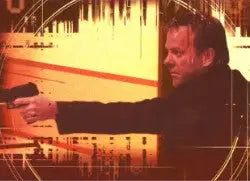 Man in dark clothing reaching for a foil puzzle in Twenty Four Season 4 card set