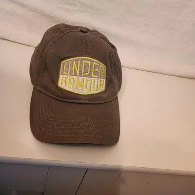 Brown Under Armour hat cap with yellow and white embroidered logo in an olive green flex stretch fit