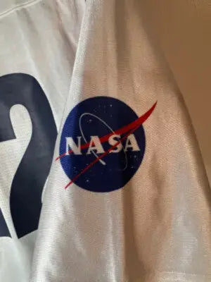 Under Armour White Men’s Jersey XL with short sleeves and NASA patch on right sleeve