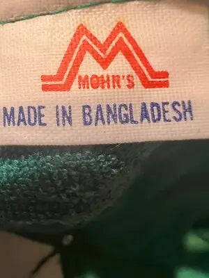 White clothing tag with red and blue lettering on Unisex Mohr’s Hat Green Casino Magic