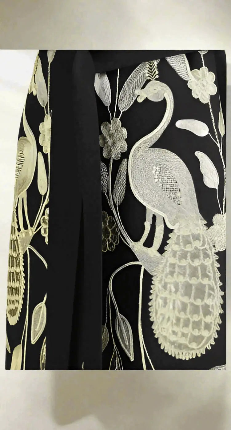Black embroidered long vest with gold and white flamingo, flower, and foliage embroidery