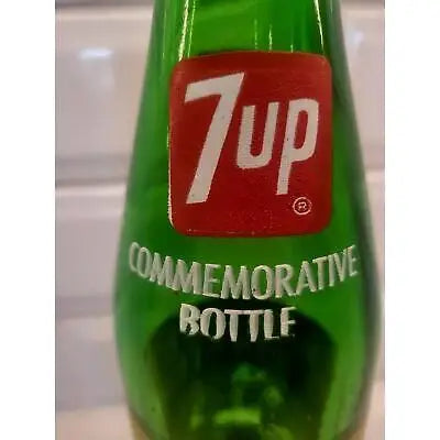 Green 7UP commemorative bottle featuring Notre Dame Fighting Irish football logo
