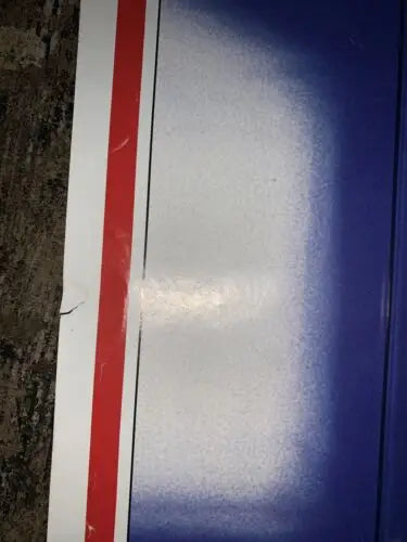 Blue, white, and red striped surface of Vintage 1984 Sports Illustrated Ozzie Smith Poster