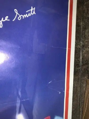 Autographed blue Ozzie Smith poster with red and white border from Sports Illustrated