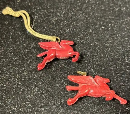 Two Red Pegasus charms from Vintage Celluloid Mobil Oil prize toy lot