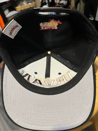 Black racing snapback hat with light grey brim from Vintage Nut Meg Ernie Irvin NASCAR collection
