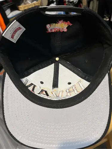 Black racing snapback hat with white underside brim from Vintage Nut Meg Ernie Irvin NASCAR collection