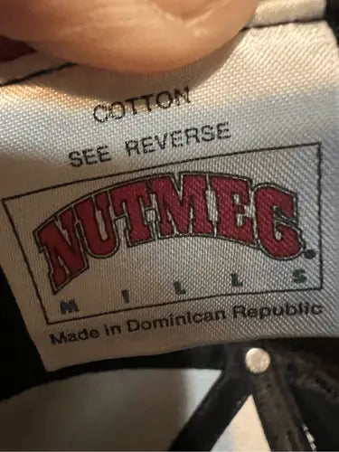 Clothing label with brand and origin info on Vintage Nut Meg Ernie Irvin NASCAR racing snapback hat