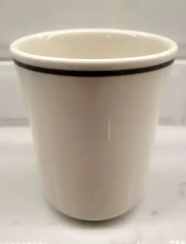 White China coffee mug with black rim featuring England Patriots logo