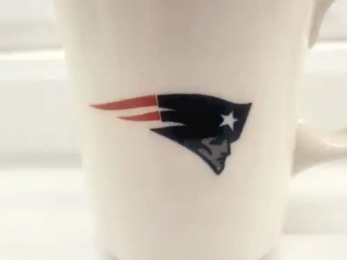 White china coffee mug featuring the England Patriots logo for NFL fans