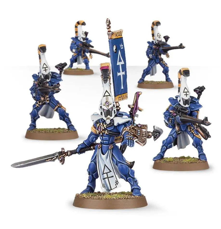 Blue and white Eldar Dire Avengers miniatures with shuriken catapults and banner