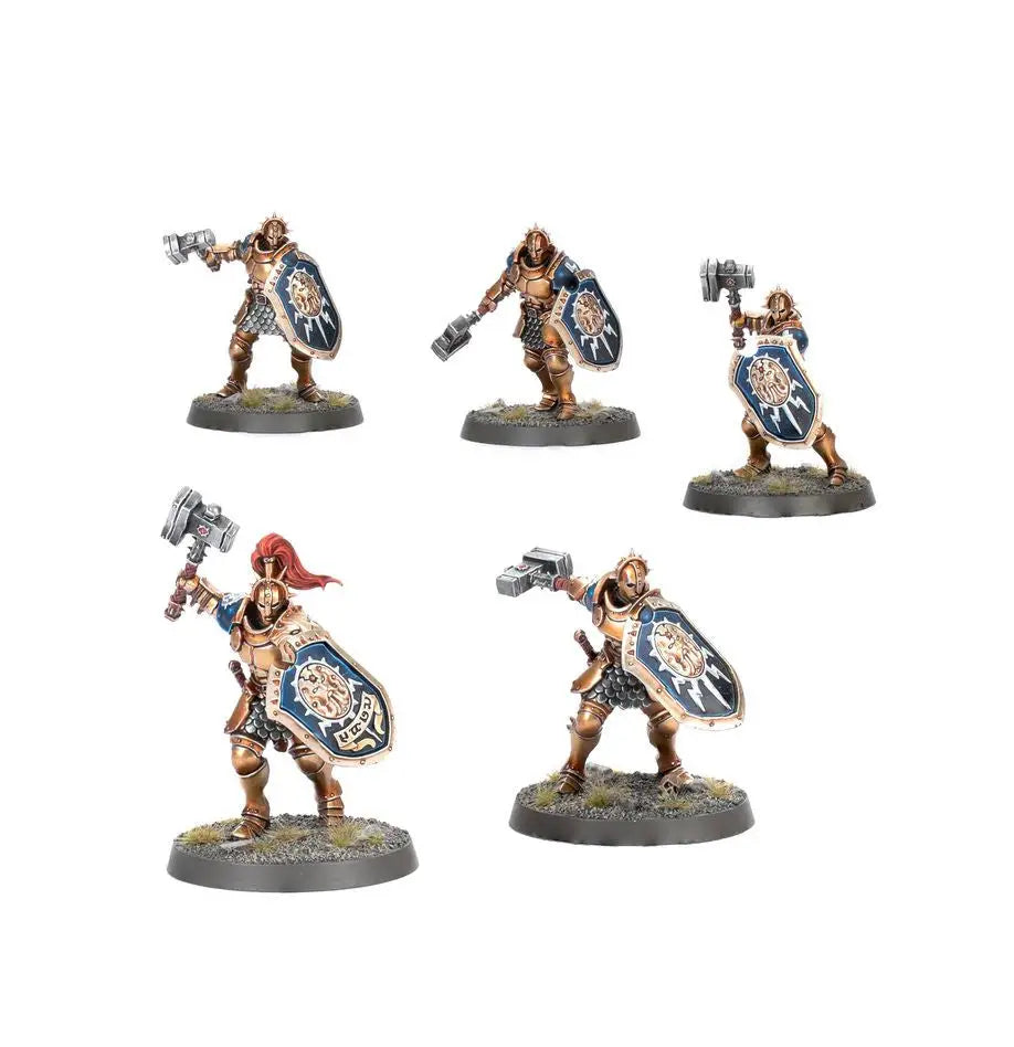 Five painted miniature warriors with shields and hammers for Warhammer AGE OF SIGMAR