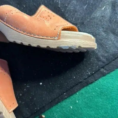 Tan leather slide sandals with open-toe wedge and perforated details from White Mountain