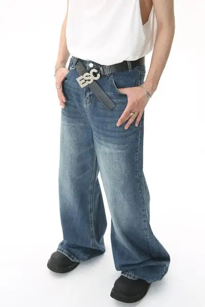 Wide leg blue jeans with black belt and silver ESC buckle for stylish casual wear