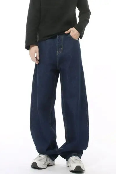 Dark blue wide leg jeans with pockets on a person, stylish and comfortable fit