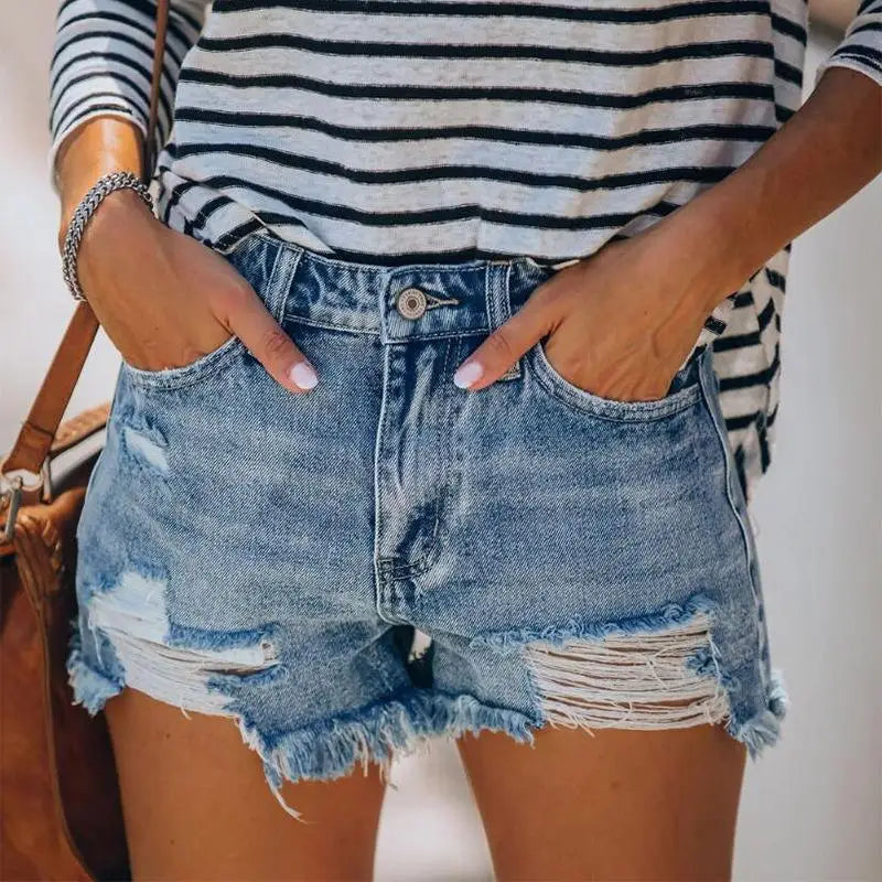 Women fringe denim jeans shorts featuring distressed denim and striped top for casual style