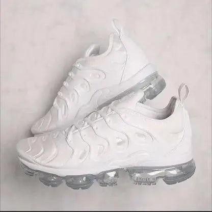 Womens breathable white Nike Air VaporMax Plus running shoes with translucent soles
