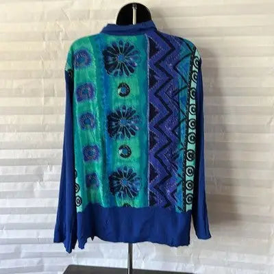 Vibrant blue and green floral and geometric long-sleeved tunic blouse for women