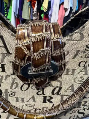 Sag Harbor women’s tote bag featuring a brown and beige patterned design with decorative clasp