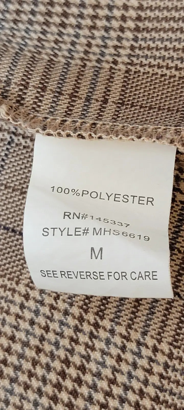 Clothing tag for Y2K plaid mini skirt made of 100% polyester, size M, style MHS6619