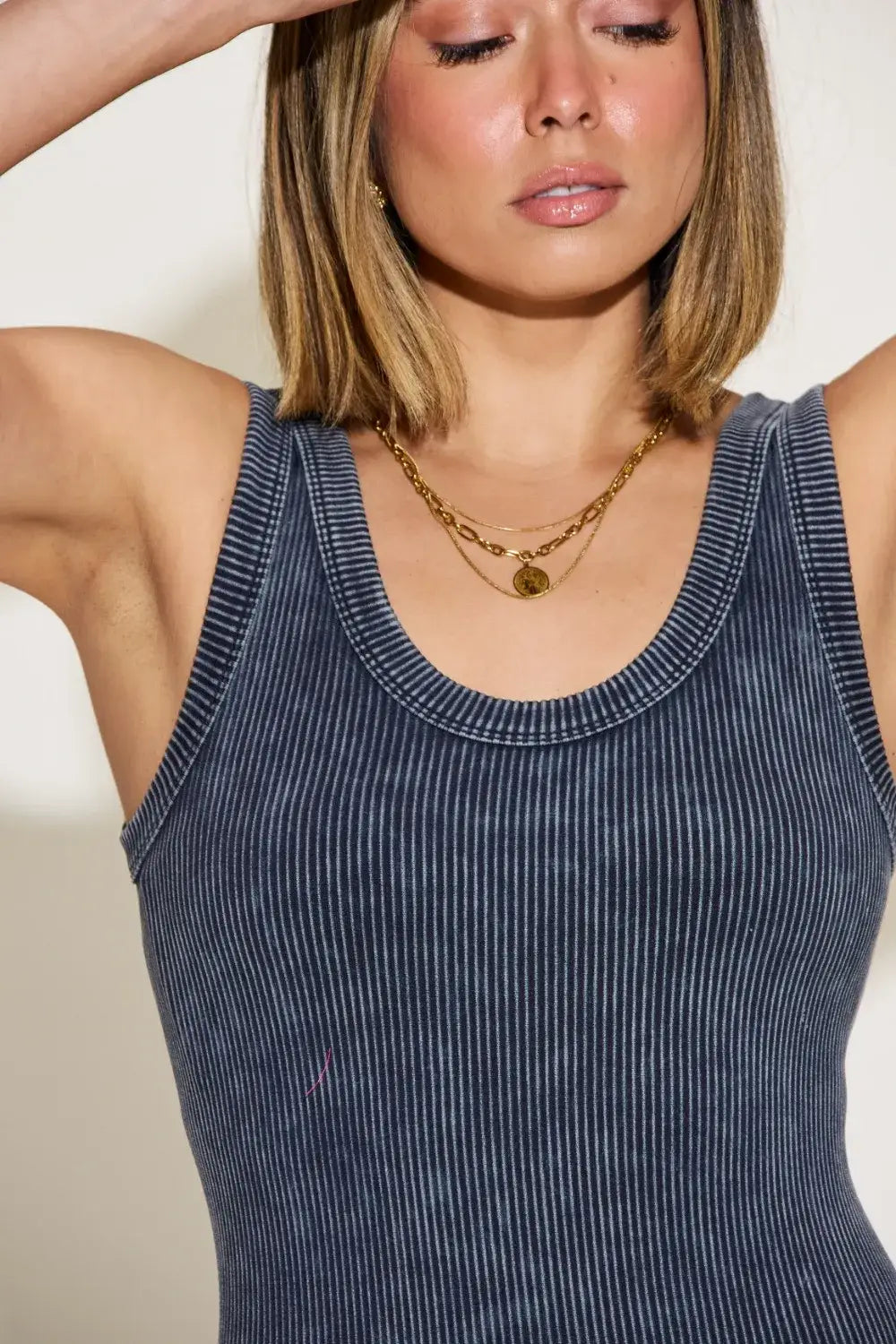 Navy blue ribbed washed round neck tank top with gold chain necklace and earrings